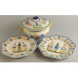 Three items of Quimper of France, to include two similar plates and a tureen and cover