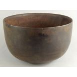 A large turned wooden hardwood bowl, with later oak base, 35.5cm dia.