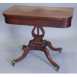 A George IV mahogany tea table, the D-shaped top on a lyre support with canted and concave platform,