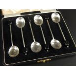 A set of six George VI silver coffee bean spoons, in a fitted case