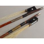 Two violin bows, one stamped P W Bryant, the other unmarked. (AF)