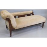 A late Victorian walnut chaise lounge, later upholstered in brown draylon on turned legs.