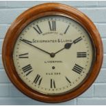 A late 19th/early 20thC oak railway wall clock, the white dial bearing inscription 'Warranted By