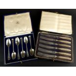 A set of six associated 18thC silver Old English pattern teaspoons, some bearing maker's mark SA and