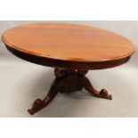 An Eastern hardwood dining table, in early Victorian style, the circular top with a moulded edge