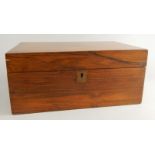 A Victorian walnut writing box, the hinged lid with a vacant brass cartouche, 36cm wide.