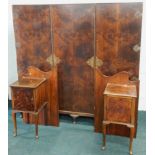 An early to mid 20thC figured walnut triple wardrobe, with brass hinges and locks, 183cm wide, and