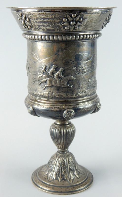 A Victorian silver horse racing trophy, the tapering border cast with patera, above a gadrooned band
