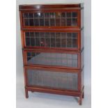 A Globe Wernicke mahogany three sectional solicitor's type bookcase, with leaded glazed sliding