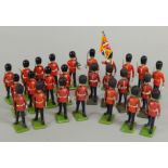 A collection of Britains Scots Guards, hand painted die-cast soldiers to include a Standard Bearer.