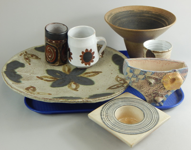 A quantity of Studio pottery, to include a large charger decorated with leaves, a Lucy Rie style