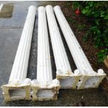 A collection of four internal gesso cream painted pillars, each with a fluted central section and