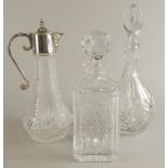 A claret jug, with silver plated mount, and two decanters and stoppers.