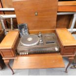 A Dynatron radiogram, in a walnut case with integral speakers, on cabriole legs