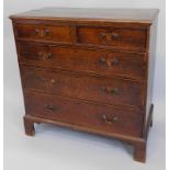 A North Country oak and mahogany crossbanded and chequer banded chest of drawers, the top with a