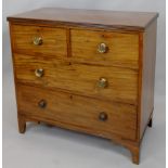 An early 19thC mahogany chest, of two short and two long drawers, each with brass handles, on