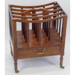 A mahogany music Canterbury in the George III style, with four divisions above a frieze drawer on
