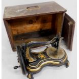A late 19thC Jones cast iron sewing machine, with gilt decoration of leaves, transfer printed