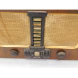 His Master's Voice walnut and Bakelite valve radio, 50cm wide.