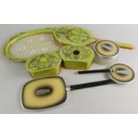 A collection of 1930's early plastic boudoir dressing table sets, to include a marbled green example