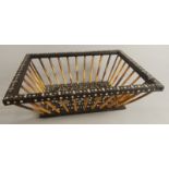 An early 19thC Anglo Indian ebony ivory and porcupine quill basket, of tapering form, 26cm wide. (