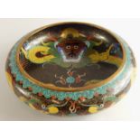 A Chinese cloisonné dish, decorated to the interior and exterior with a dragon on a black ground,