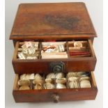 A 19thC mahogany apothecary cabinet, with two drawers and overhanging top, revealing various