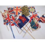 Various Union Jack and other flags, and a Polynesian type grass skirt.