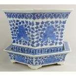 A Chinese blue and white porcelain hexagonal jardiniere and stand, decorated with flowers and