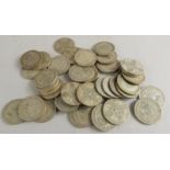 A quantity of pre-1946 two shilling coins.