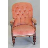 An early Victorian mahogany open armchair, upholstered in pink draylon, on turned legs.