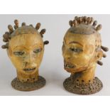 Tribal Art. A pair of African skin coloured busts, each modelled in the form of a female figure with