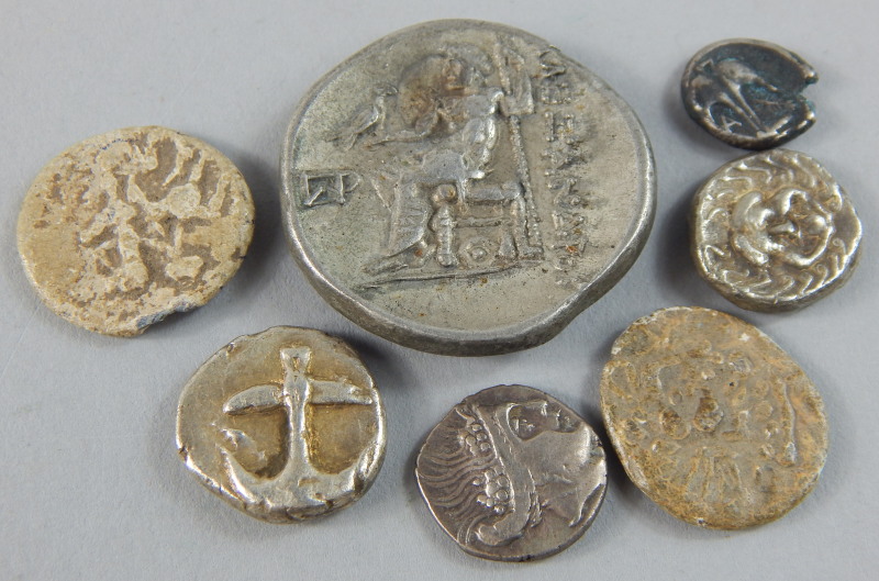 A collection of Greek white metal coins, to include a silver Drachm, cast with the Gorgonian head,