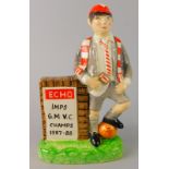 A ceramic porcelain figure, of a young Lincoln supporter in Burslem Staffordshire, by Echo