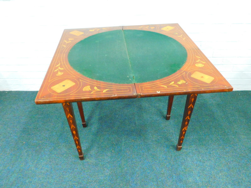 An early 19thC Dutch mahogany and floral marquetry card table, the rectangular top hinged to - Image 2 of 2