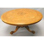 A Victorian figured walnut circular dining table, the quarter veneered top with parquetry roundel,