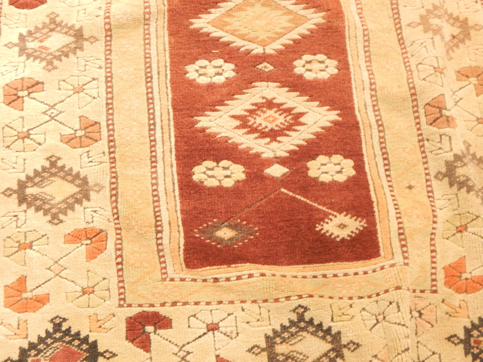 An Anatolian Turkey rug, with a design of medallions, etc, on a red ground, with one wide and two - Image 2 of 3