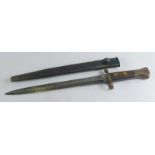 A 19thC C5W bayonet, with plain blade stamped with crown, wooden studded handle and metal end,