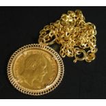 An Edward VII full gold sovereign pendant, on a 9ct gold chain, on fine link chain, 8.3g all in.