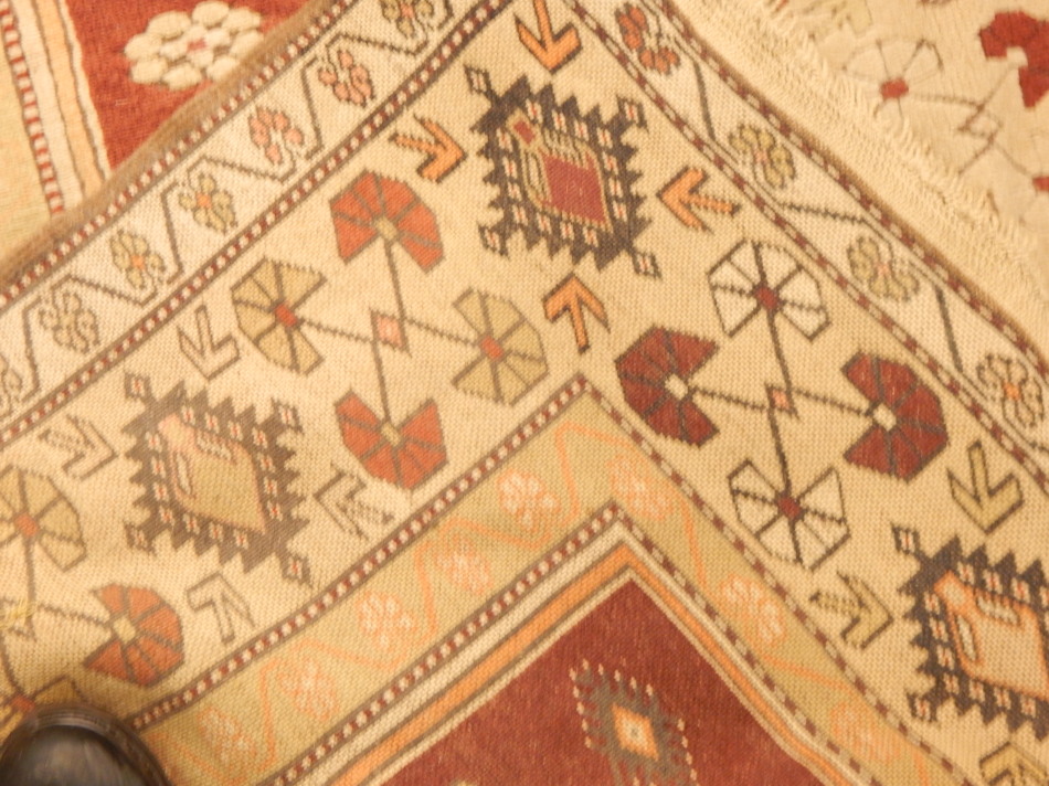 An Anatolian Turkey rug, with a design of medallions, etc, on a red ground, with one wide and two - Image 3 of 3