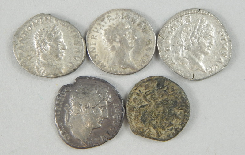 Five Roman and Roman style coins, to include two from the reign of Hadrian, 117-138AD etc.