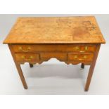 A late 19thC/early 20thC North Country oak and mahogany crossbanded lowboy, with one long and two