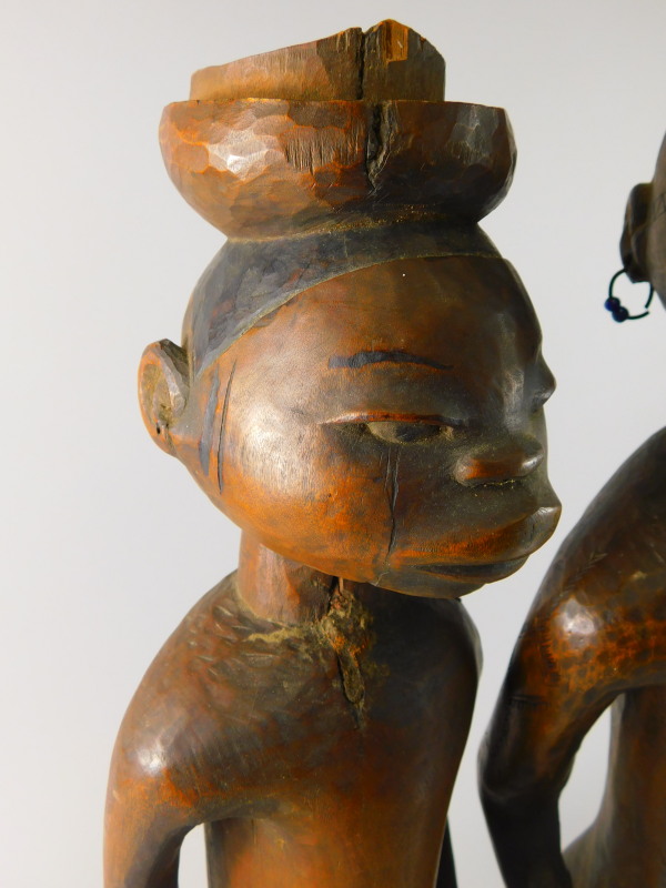 Tribal Art. A pair of early 20thC African fertility type figures, the female figure with earrings - Image 2 of 5