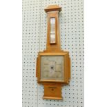 A walnut Art Deco style barometer, the silvered dial stamped Pursers Portsmouth, 69cm high