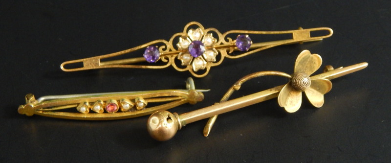 Three stick pins, to include a Victorian amethyst and seed pearl bar brooch, yellow metal, unmarked,