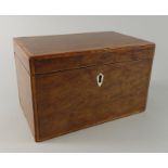 An early 19thC mahogany and satinwood banded tea caddy, the hinged lid enclosing two lidded