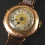 A 9ct gold wristwatch, with circular watch head, on silvered and gold coloured value, with thin