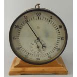 A German Junghans table stopwatch timer, in metal case with later beech stand, the dial 20cm