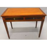 An Edwards & Roberts Edwardian mahogany writing table, the top with a brown leather insert above two