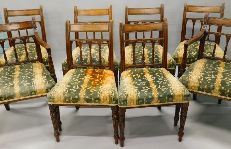 A set of eight George IV mahogany dining chairs, each with a reeded spindle turned support to the